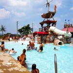 Families play together in waterpark pool