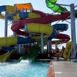 Father and daughter prepare to climb the waterslide