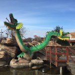 Double headed green dragon decor at mini golf course