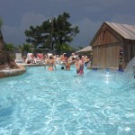 Women swim in crystal clear water in OC waterpark