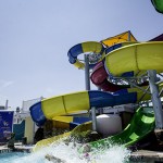 Visitor makes a big splash coming out of waterslide at waterpark