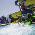 Man splashes into water from waterslide