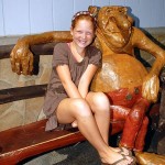 Girl sitting on bench with troll decor in Fenwick Island
