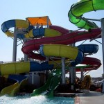 Visitors wait in line to ride the waterpark waterslide in OC