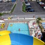 View of the pool and lounge area from top of waterslide