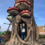 Troll holding lantern in mushroom tree