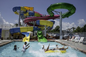 Father and son make a big splash from waterslide