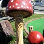 Mushroom decor on miniature golf course